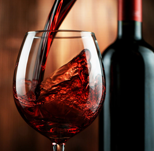 Red wine being poured into a wine glass