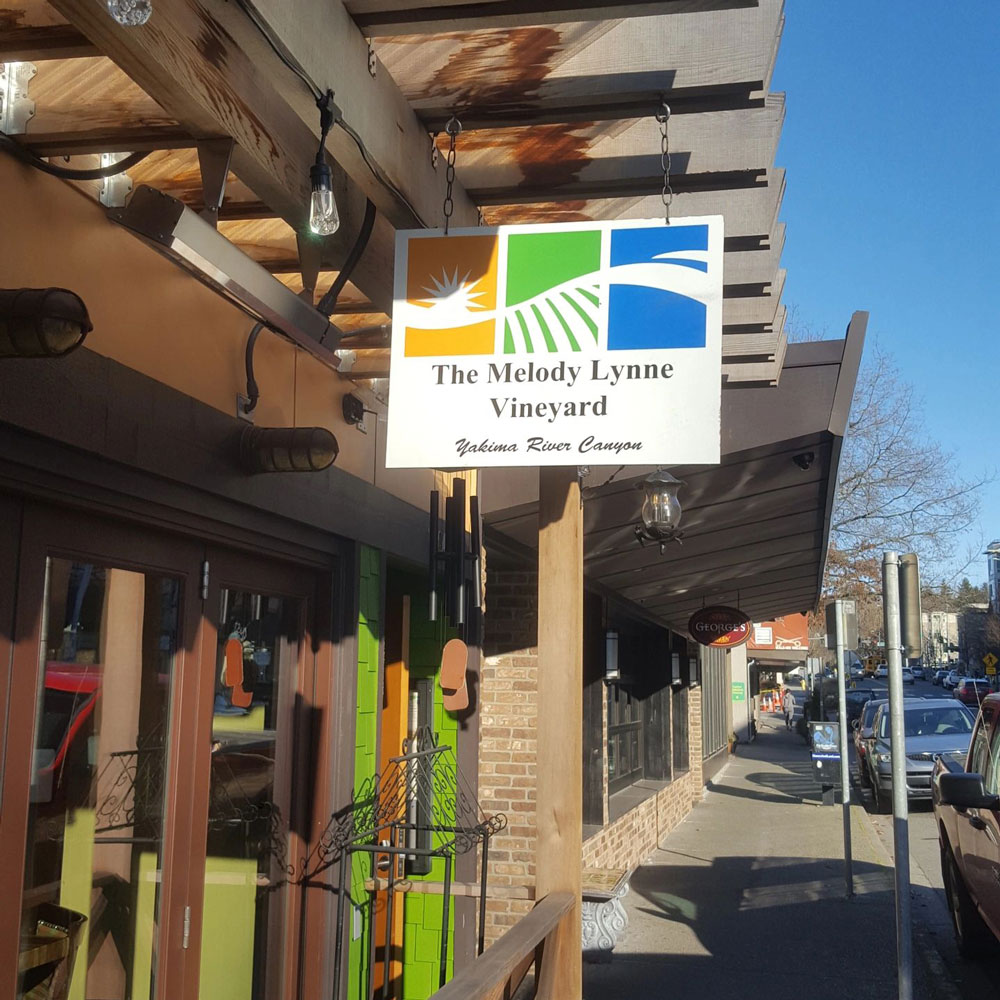 The Melody Lynne Vineyard storefront sign